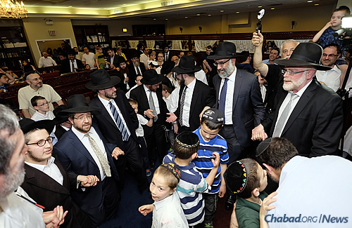 Men and boys danced inside the synagogue to celebrate the new Torah's arrival. (Photo: Deja Views)