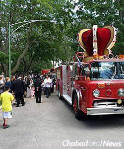 The parade was led by a retro-fitted firetruck, complete with a crown to mark the occasion.