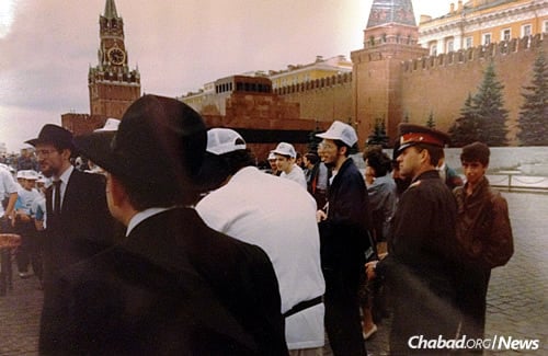 Camp Gan Israel Moscow at Red Square, with Chief Rabbi of Russia Berel Lazar standing on the far left as a policeman looks on.