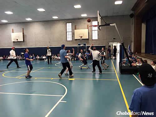 Myers, in back, third from left, as a referee at a student-faculty basketball game at Torah Academy of Greater Philadelphia in Wynnewood, Pa., where he works in the off-season as athletic director—the faculty won 24-19. (Photo: Torah Academy of Greater Philadelphia)