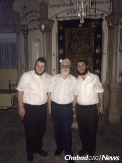 Tubul, right, and Rabbi Mendel Wolowik with the president of the Jewish community of Ioannina in the Romaniote synagogue, said to be more than 1,000-year-old