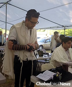 The minyan draws hundreds of worshippers most of July and all of August.
