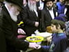 The Rebbe Distributing Charity