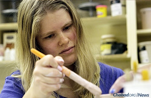 Stephanie Harris of West Bloomfield, Mich., concentrates on pottery.