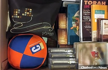Armed with a box of vital items for those they met: tefillin, kipahs, mezuzahs, books and more.