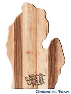 A cutting board by an artist with his logo, “Daniel in the D,” referring to Detroit&#39;s “Chabad in the D”