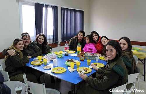 Batsheva Cohen runs a yearly program for local soldiers focusing on the three unique mitzvot of women, with challah-baking, making Shabbat candlesticks and touring the women’s mikvah.