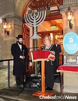 The rabbi with the Lord Mayor of Cardiff Councillor Margaret Jones, addressing those gathered last Chanukah for the city's first public menorah-lighting.