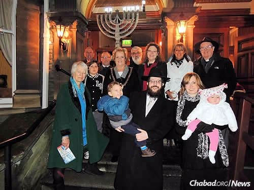 The Roses with Jones, and local parliament members, assembly members and religious leaders at the city's first public Chanukah menorah-lighting on Dec. 21, 2014, in front of the Mansion House, the official residence of the Lord Mayor of Cardiff.