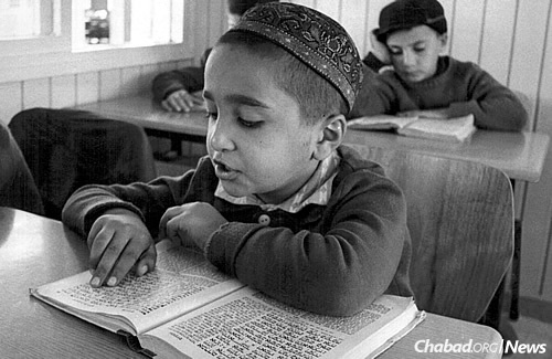 A Bukharan child studies at Schiff&#39;s yeshivah. Schiff connected with the students and the families, including linguistically, building a massive institution in the process.