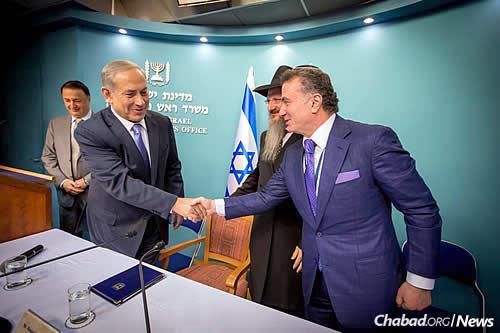 The premier and Jewish philanthropist Mikhail Mirilashvili, who is based in Russia and Israel. Philanthropist Lev Leviev, president of the Federation of Jewish Communities of Russia, is at the left. (Photo: Ezekiel Itkin)