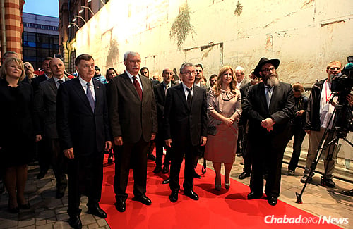 Members of local Jewish community, business and cultural leaders, and heads of city administration attend the recent opening of the Small Synagogue after four years of renovations.