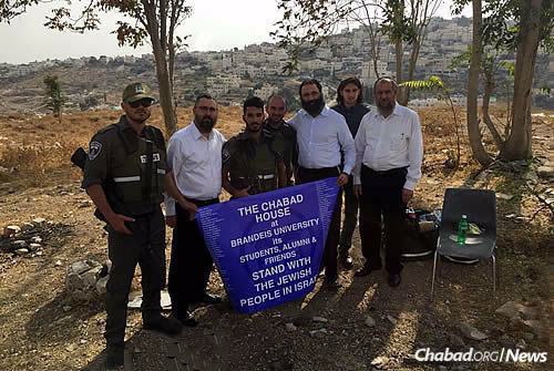 Chein, Kutner and Miller, along with Rabbi Ahronchik Prus, right, of the Chabad Youth Organization, visit soldiers guarding the Armon Hanatziv neighborhood of Jerusalem, where several terrorist attacks have taken place over the course of the month.