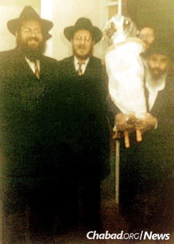 At one of the Torah celebrations in Israel: from left, Rabbi Reuven Helman, Rabbi Natan Oirechman and Rabbi Moshe Shmuel Oirechman
