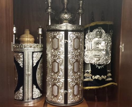 Ashkenazi and Sepharadi Torah scrolls share an ark at Lubavitch Chabad of Skokie.
