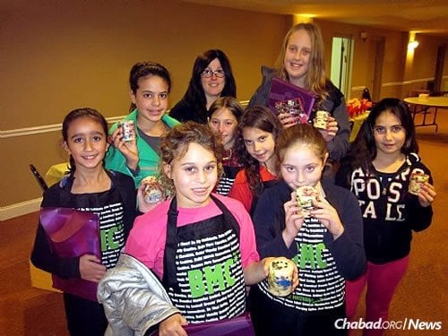 A group of girls from a prior club year. Hannah Newman, second from right, now 15, enjoyed the experience; her younger twin sisters have started taking part in it. To her left is Shterna Kaminker, coordinator of the club and co-director of the Israeli Chabad Center in Voorhees, N.J.
