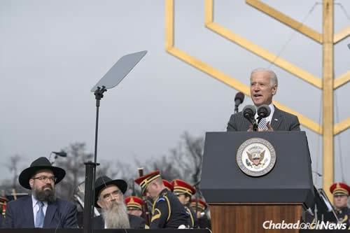 U.S. Vice President Joe Biden addresses the crowd at the 2014 National Menorah lighting, as Rabbi Levi Shemtov, left, and Rabbi Abraham Shemtov look on. (Photo: Ron Sachs)