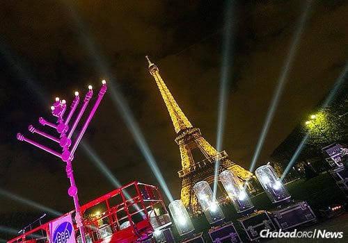 The lighting of a giant menorah will take place at the base of the Eiffel Tower on Sunday—the first night of Chanukah—despite the fact that Paris is still grappling with the aftermath of recent terror attacks. Chabad will also sponsor outdoor public lightings around the city and its suburbs. (Photo: Chlouchim.com)