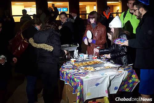 Students, faculty and guests turned out for the event, enjoying latkes, dreidel games and music.