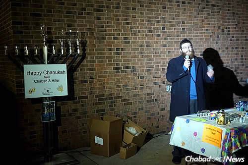 Rabbi Hersh Loschak, co-director of Chabad at Rowan University in Glassboro, N.J., led the first-ever public menorah-lighting ceremony on campus, just days after vandalism was found carved into a dormitory door.