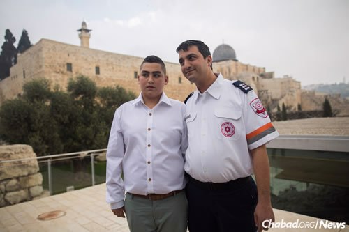 Naor, left, and David Dalfon, a paramedic with the Magen Dovid Adom national emergency rescue service, who was the first responder at the scene and is credited with saving the boy’s life.