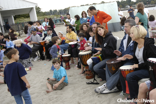 A drum circle was part of Sukkot on the Beach at Jennings Beach in Fairfield.