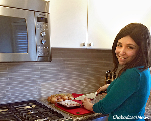 Malkah Esther (Michelle) Glass in the kosher kitchen of her new home in Toronto, which she shares with her husband, Calev (Eric) Taylor.