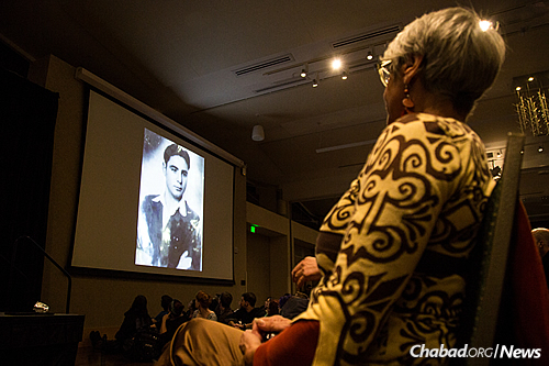 Rosa's older daughter, Regina, watches a video made about her family. (Photo: Ryan Arb)