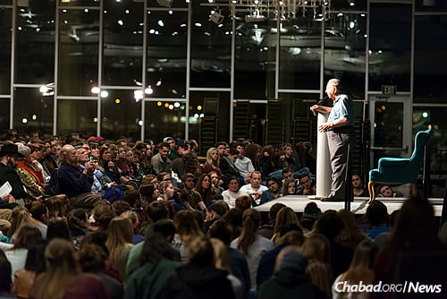 A whopping 1,500 people attended the talk, with students crammed on the floor in front of the podium. (John Eisele/CSU Photography)