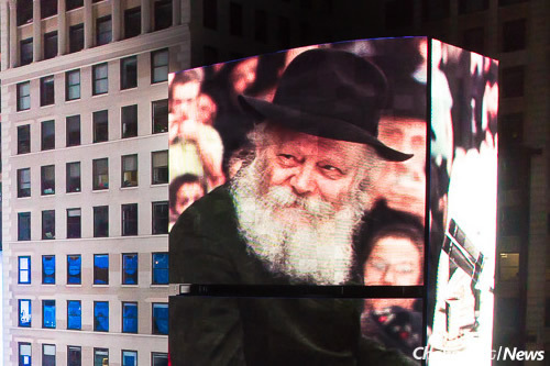 From small hand-held devices to computer and television screens of all sizes to giant displays like the one above at a CTeen Havdalah ceremony and concert in Times Square, videos of the Lubavitcher Rebbe produced and distributed by Jewish Educational Media (JEM) inspire audiences all over the world. (Photo: Mendel Benhamou/CTeen.org)