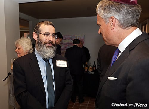 Rabbi Levi Haskelevich, left, with keynote speaker Jon Huntsman Jr., himself a graduate of Penn (Photo: Marc Smiler)