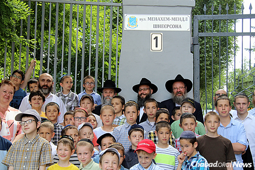 Boys from the yeshivah attended the unveiling of the plaque, and are told that going to school on a street bearing the Rebbe&#39;s name carries with it a responsibility. (Photo: Dnepropetrovsk Jewish Community)