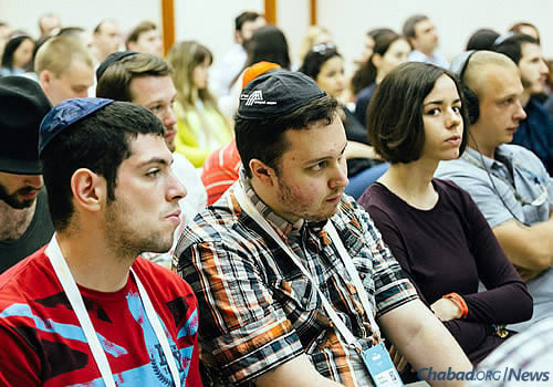 Attendees listen to the announcement of the project at last month’s youth forum. Publishing the Talmud, a foundational text in Jewish life, was forbidden during Communist rule in Russia.