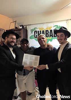 Celebrating the newly printed Tanyas at the Chabad House in Montigo Bay.