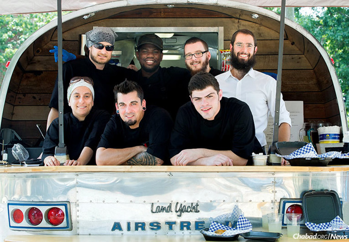 The cooking crew at Aryeh’s Kitchen, led by 21-year-old Zack Freeling, bottom row, far right. Freeling father’s, Ken, and Rabbi Shlomo Rothstein, top row, right, worked together to establish a full-service kosher food truck at Vanderbilt University in Nashville, Tenn. (Photo: Courtesy of Vanderbilt University/Susan Urmy)