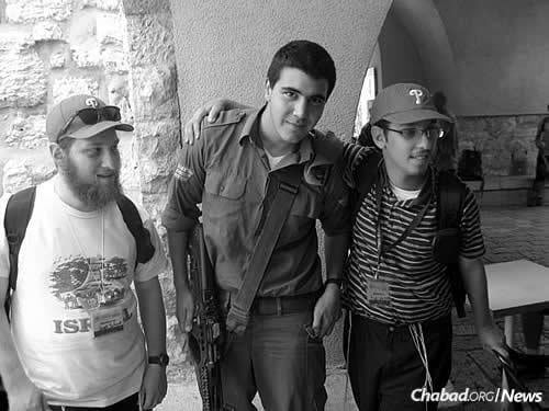 Yossi and Laible Schmidt with an Israeli soldier in the Old City of Jerusalem