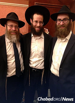 Rabbi Shmuel Weinstein, left, with University of Pittsburgh alumni Alex Brothman and Ben Dynan
