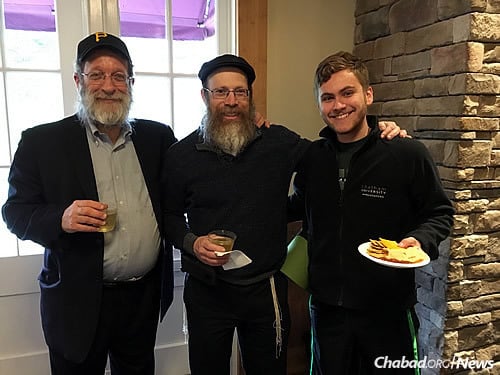 Shlomo Perelman, CEO of Pinsker&#39;s Judaica and Cafe Eighteen, left, speaks at Chatham University about the history of kosher wine in Pittsburgh. Next to him are Rabbi Shmuel Weinstein and Chatham student Jeremy Witchell.