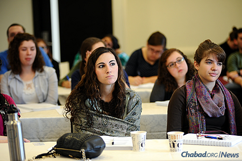 The data suggests that those with moderate and high levels of participation in Chabad come closer to the mainstream Jewish community in the post-college years. (Photo: Chabad on Campus International)