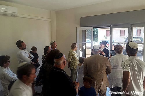 Rabbi Yossef Pinson, in doorway, executive director of Chabad-Lubavitch of Nice-C&#244;te d’Azur, started visiting the Jews of Corsica more than 40 years ago.
