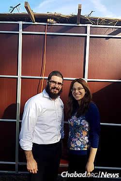 Rabbi Levi and Mushky Dubov, co-directors of Chabad of Bloomfield Hills, Mich., in their finished sukkah