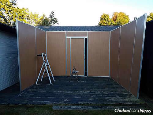 The Dubov sukkah in the works before the start of the holiday