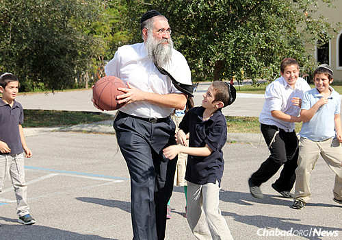 Rabbi Minkowicz has possession of the ball and goes for a shot …