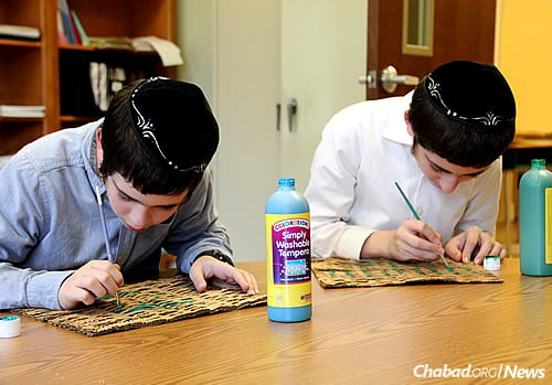 Art is taught and encouraged at school; here, two brothers get creative.