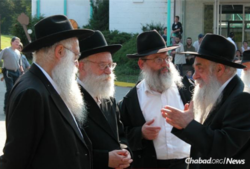Rabbi Zweibel, left, with Rabbi Meir Tzvi Gruzman, Rabbi Zalman Gopin and Rabbi Yoel Kahn at the annual Yarchei Kallah gathering of leading Chabad-Lubavitch rabbis in Upstate New York.