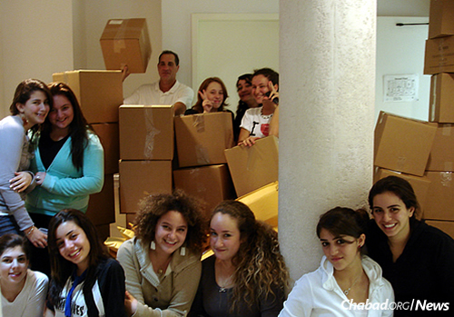 Kids of all ages help with the packing. (Photo: Courtesy of the Aleph Institute)