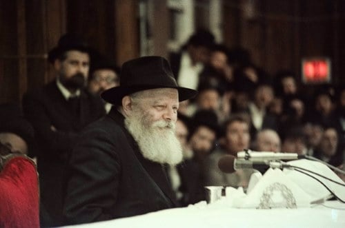 This photo was taken at the first farbrengen led by the Rebbe after suffering a
major heart attack. Unbeknownst to most of the audience, doctors were using
cardiac monitors to observe the Rebbe’s condition throughout the farbrengen.