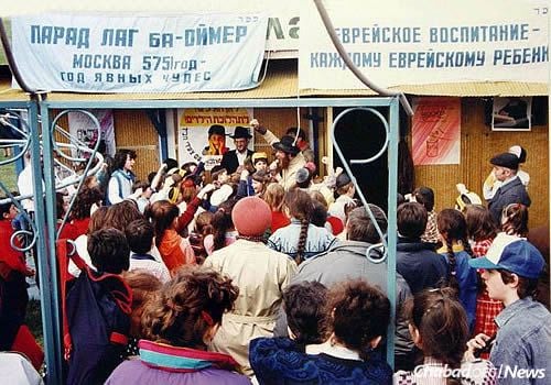 Rabbi Berel Lazar, center, leads children during a Lag BaOmer parade in Moscow in mid-1991, some seven months before the Soviet Union's ultimate demise.