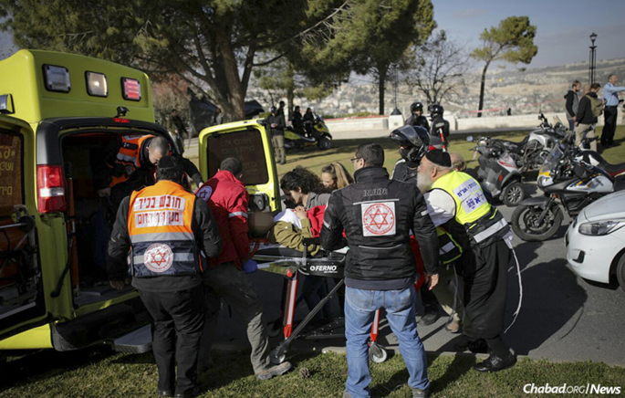 Emergency medical teams at the scene of a Jerusalem truck terror attack on Sunday that killed four young Israeli soldiers and injured 15. (Photo: Yonatan Sindel/Flash90)