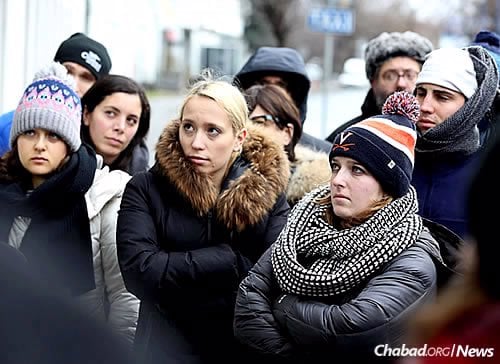Sydney Persing , 20, center, with other students on a Chabad-sponsored trip to Poland in December. (Photo: Bentzi Sasson, Chabad.edu)